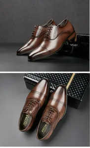 Detail of brown leather cap-toe dress shoes with brogue perforations and lace-up design