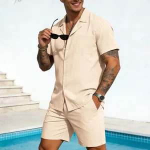 Stylish men's beige two-piece linen-style short sleeve shirt and shorts set by the pool.