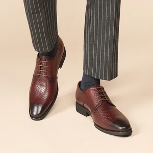 Handcrafted brown leather derby shoes with embossed texture for business formal wear.