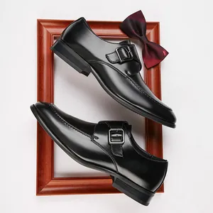 Elegant black leather monk strap dress shoes for men in a formal business style.