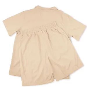 Back view detail of a beige men's casual two-piece set featuring shirt and shorts