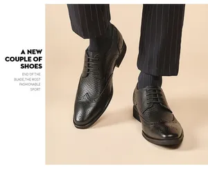Detailed close-up view of black leather brogue wingtip business dress shoes for men