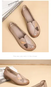 Close-up of soft leather flat loafers with butterfly embroidery for elderly women