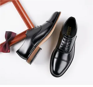 Top view of black leather cap-toe oxford shoes for men's business formal wear