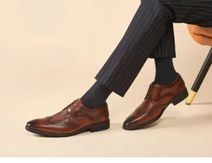 Close-up detail of handcrafted brown leather Brogue Derby shoes for men in a formal business style