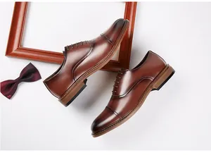 Top down detail view of premium brown leather cap-toe oxford dress shoes for men