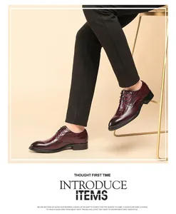 Men's burgundy Brogue shoes with crocodile pattern on a model in a lifestyle setting