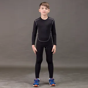Full view of kids black quick dry compression sports set with contrast stitching