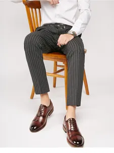Close-up of brown leather Oxford dress shoes with a classic cap toe design.