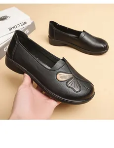 Comfortable black soft leather flat loafers for elderly women with non-slip sole