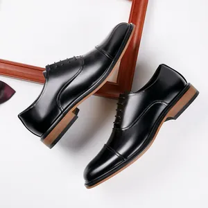 Classic black leather cap-toe Oxford dress shoes for professional business and wedding wear