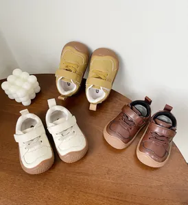 Variety of colors for soft-soled baby walking shoes displayed on a wooden table