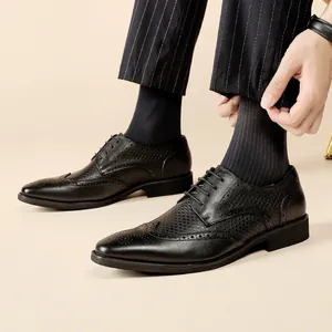 Black genuine leather Brogue Derby shoes with handcrafted carved detailing for men.