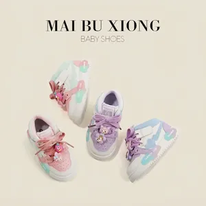 Cute and colorful toddler sneakers featuring pastel color-blocking and cartoon charms