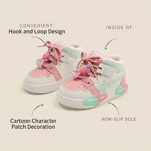 Cute pink and white color-block high-top kids sneakers with velcro straps and cartoon charms