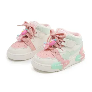 Cute pink and mint green color-block children's sneakers with cartoon charms for girls