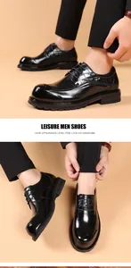 Detailed view of men's black leather business shoes with thick soles and lace-up closure
