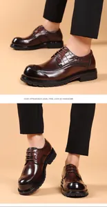 Detail view of men's brown business leather shoes with chunky sole and croc texture