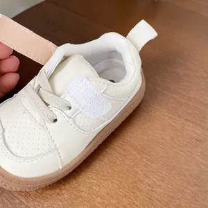 Premium soft leather cream toddler walking shoes with adjustable velcro strap for infants