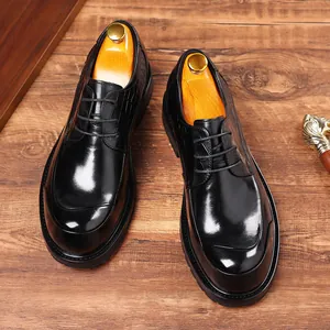 Elegant black genuine leather business shoes with thick soles and embossed texture