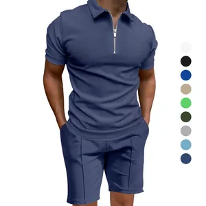 Dettaglio completo polo uomo blu navy, maglia a nido d'ape, zip e pantaloncini coordinati.