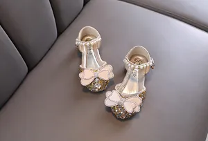 Sparkling girl's princess dress shoes with pearl straps and decorative bows