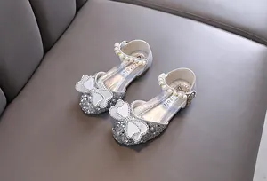 Elegant silver glitter girls princess shoes with bow and pearl ankle strap detail