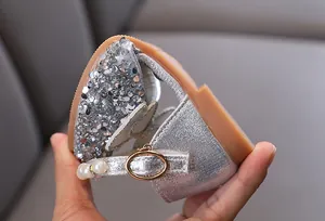Detail of girls silver glitter princess shoe with pearl strap and sequins