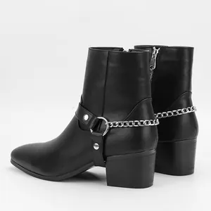 Stylish men's black leather ankle boots featuring metal chain details and high heels