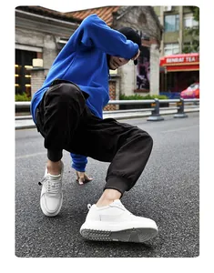Detail view of stylish men's white leather sneakers with 8cm hidden height increase