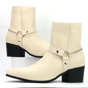Detailed side view of cream men's fashion boots featuring silver chains and block heels