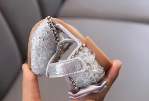 Detail shot of flexible silver rhinestone princess shoe for girls dance performance