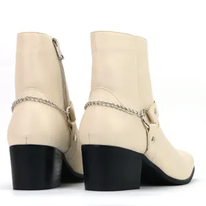 Rear view of cream men's fashion boots with silver metal chain detail and block heel.
