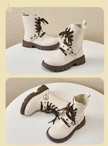 Detailed view of children's cream Martin boots with brown laces and side zipper