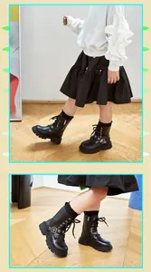 Detailed view of children's black Martin boots with side zipper and buckle design