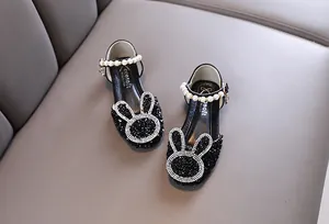 Top view of girls' black sequin princess shoes with rhinestone bunny and pearl strap