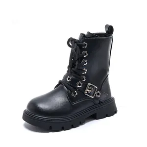 Classic kids black Martin boots with decorative flower buckle and thick lug sole