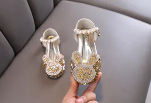 Sparkling rhinestone bunny princess shoes for girls with elegant pearl strap detail.