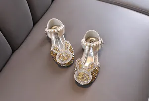 Golden sparkling princess shoes for girls with rhinestone rabbit design and pearl strap