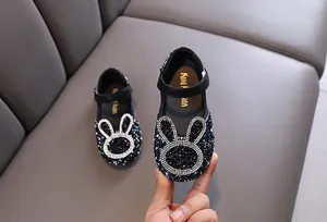 Close-up of sparkly rhinestone bunny Mary Jane shoes for toddler girls