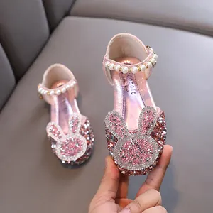 Sparkling pink girls' princess shoes with rhinestone bunny and pearl strap detail