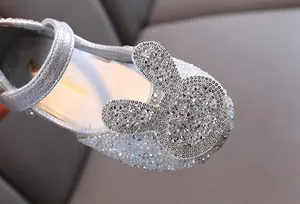 Close-up showing the intricate sparkling rhinestone rabbit detail on girls silver princess flats
