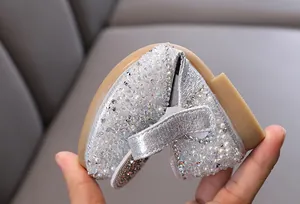 Macro view showing the ultra-flexible soft sole of silver rhinestone girls princess shoes