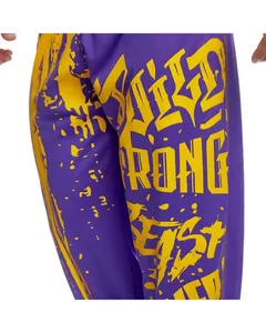 Macro detail of men's purple quick-dry sports pants with bold yellow graffiti text print