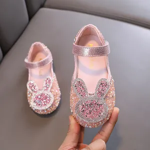 Sparkling pink girls' Mary Janes with rhinestone rabbit detail for parties