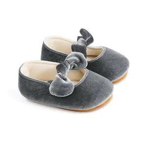 Detailed side view of soft grey velvet baby princess shoes with decorative ribbon bow