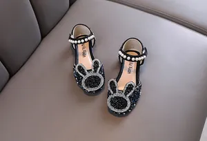 Detailed view of girls' black rhinestone princess shoes with cute rabbit design
