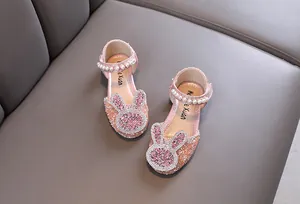 Detail view of pink rhinestone girls princess shoes with pearl strap and rabbit design