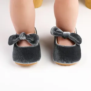 Elegant grey velvet baby princess dress shoes featuring a large bow and soft non-slip sole