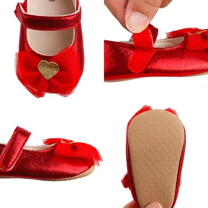 Detail views showing the shiny red material, bow ornament, velcro strap and non-slip sole